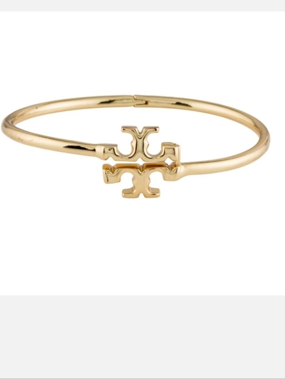 Tory Burch Eleanor Hinged Cuff bracelet in gold-plated brass.